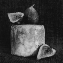 Black and white photographof  cheese and figs